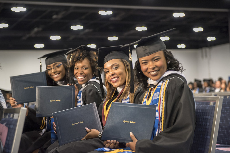 Spelman graduates standing at the ceremony