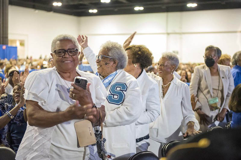 Spelman College Commencement 2024 with a group of Alumnae in the audience.